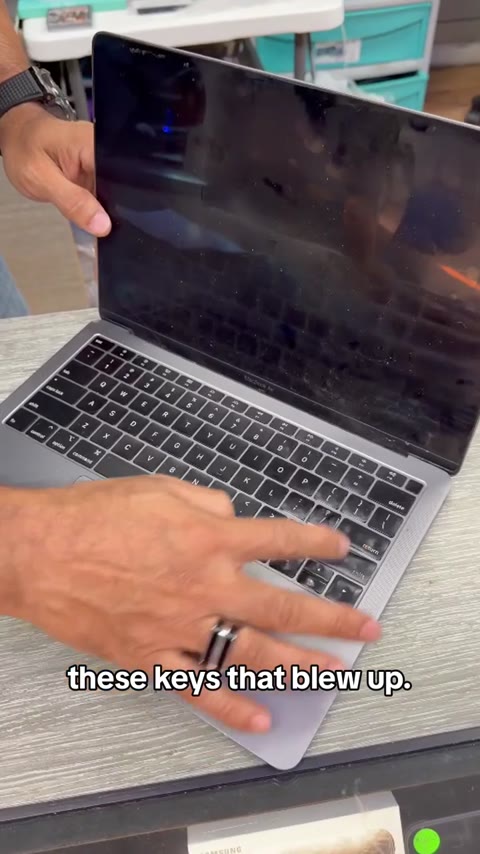 MacBook with visibly damaged keys during an initial diagnostic at Phone Repair Guy